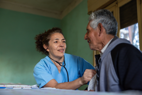 A female nurse with an older man.